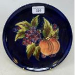 A Moorcroft pottery Showplace fruit plate, limited edition 45/75, 22 cm diameter