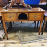 A 19th century mahogany side table, with an open section, flanked by two drawers, on square tapering