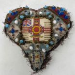 An early 20th century sweetheart bead pincushion, 20 cm wide