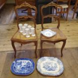 A pair of French walnut single chairs, with cane seats, two pottery meat dishes, another dish and