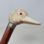 A walking stick, with carved ivory handle in the form of a duck, on hardwood shaft, 90 cm