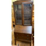 An oak bureau bookcase, three teak units, three wine racks, a pair of bookcases, an oak coffer, a