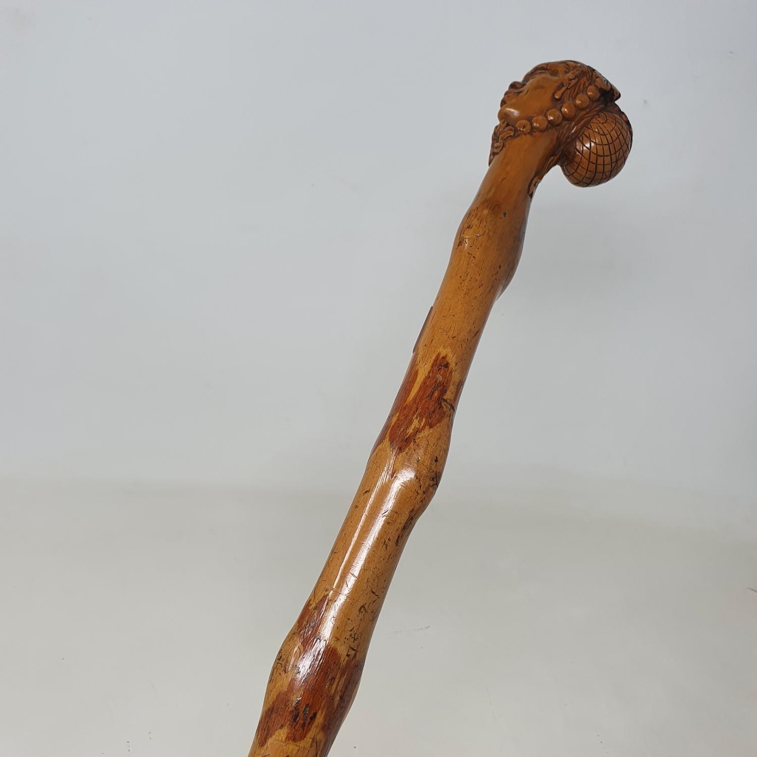 A 19th century folk art walking stick, the carved handle in the form of a lady in a bonnet and - Image 7 of 8