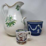 A Wedgwood Jasperware planter, 19 cm diameter, a Victorian water jug, a figure of a gentleman