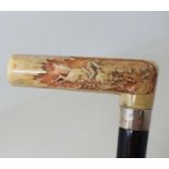 A late 19th/early 20th century walking stick, the ivory handle carved a horse and rider, engraved