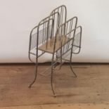 An early 20th century brass magazine rack, 78 cm high