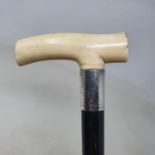 A walking stick, with carved ivory handle, on ebonised shaft, 93 cm