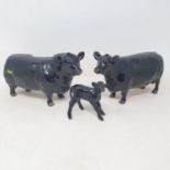 A Beswick Aberdeen Angus bull, 1562, an Aberdeen Angus cow, 1563, and an Aberdeen Angus calf,