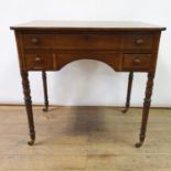A 19th century mahogany kneehole dressing table, on turned tapering legs, 81 cm wide