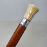 A 19th century walking stick, with carved ivory handle, on Malacca shaft, 90 cm
