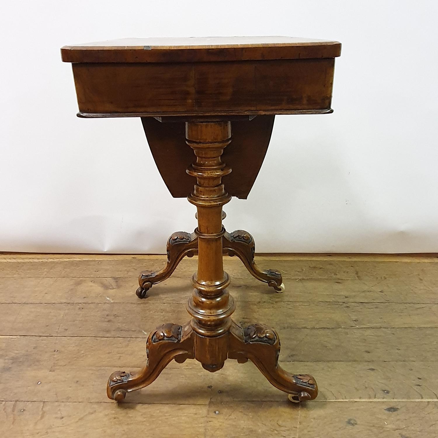 A 19th century walnut workbox, on a column supports and splay legs united by stretcher, 54 cm wide - Image 4 of 5