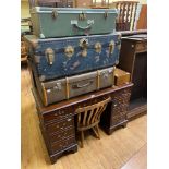 A modern mahogany pedestal desk, 124 cm, three trunks, a walnut writing box, and a chair (6)