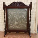 A Japanese needlework panel, decorated a heron, 52 x 54 cm, set in an oak firescreen