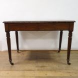 A 19th century mahogany side table, having two frieze drawers, on reeded tapering legs, 106 cm wide