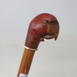 A walking stick, with carved wooden handle in the form of a parrot, with opening beak, 90 cm