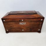 A 19th century rosewood tea caddy, with mother of pearl inlay, 33 cm wide, and an oak desk stand, 23