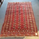 A red ground Afghan rug, 177 x 122 cm