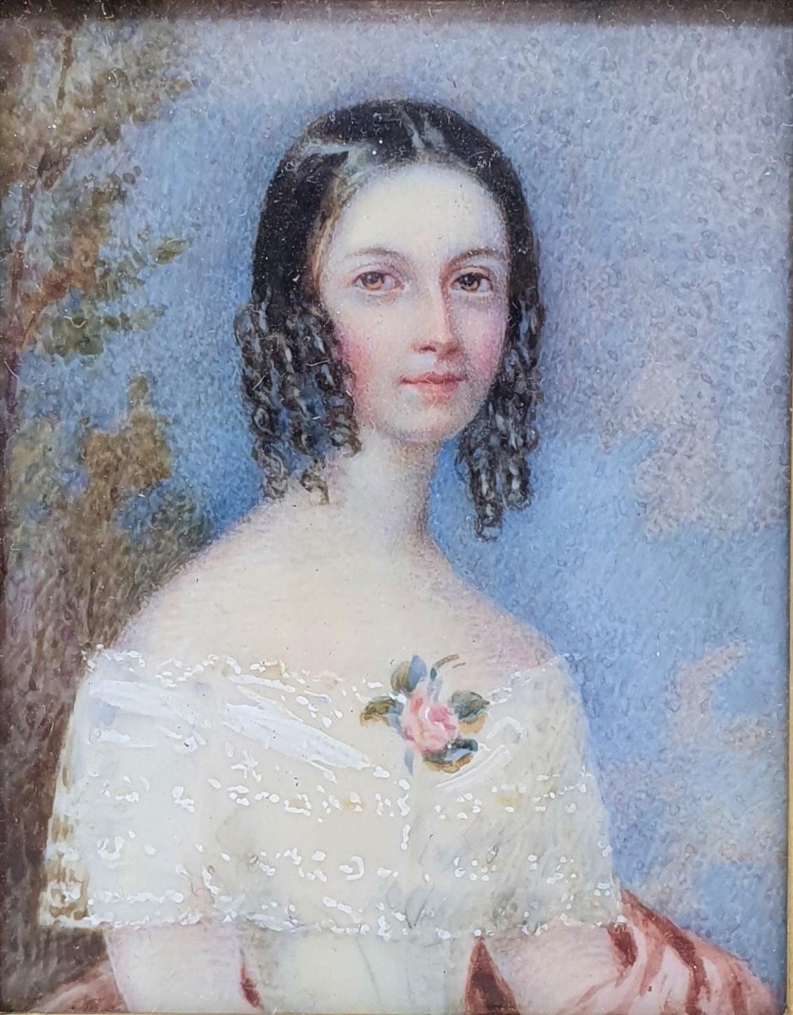 A 19th century portrait miniature, of a young lady with a flower on her dress, 8 x 7 cm