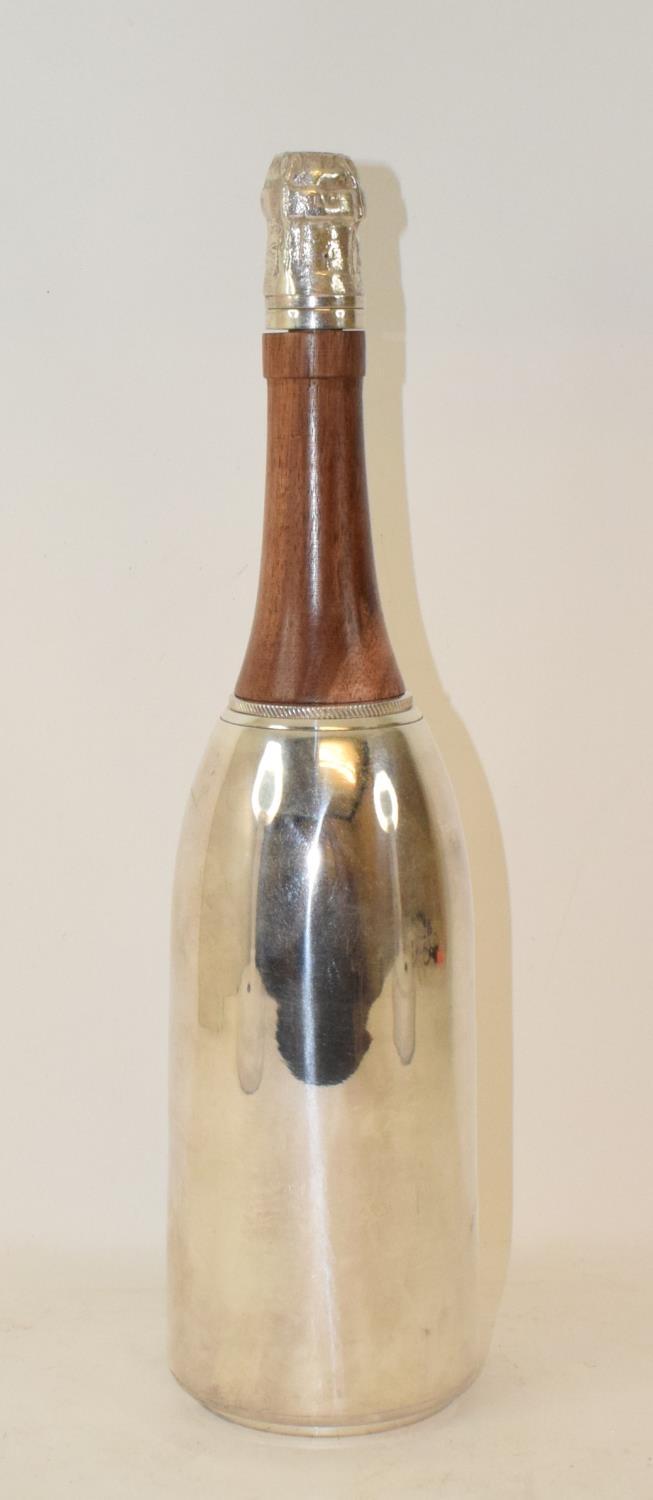 A modern silver plated and carved wood cocktail shaker, in the form of a champagne bottle, 37 cm