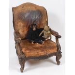 A 19th century large mahogany and leather armchair, on carved cabriole legs