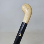 A walking stick, with carved ivory pistol grip handle, 90 cm
