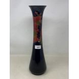 A large Moorcroft pottery pomegranate pattern vase, of slender waisted form, 41 cm high