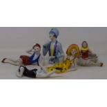 A modern porcelain pincushion head, and four other similar figures (5)