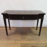 An early 20th century Adams revival mahogany side table, having a frieze drawer with carved rams