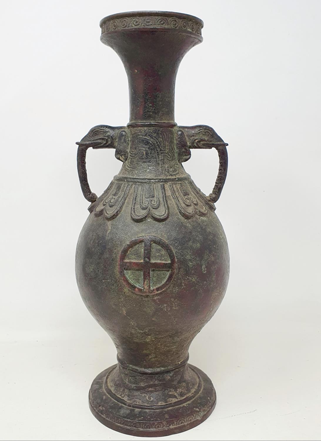 A Chinese bronze vase, with elephant handles, 31 cm high