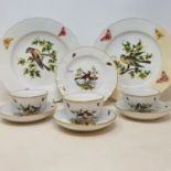 A set of three Meissen cups and saucers, decorated birds and butterflies, cross sword marks and