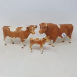 A Beswick Guernsey bull, CH. Sabrina's Sir Richmond, the 14th, 1451, a Guernsey cow, 1248A, and a