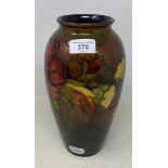 A Moorcroft pottery hibiscus pattern flambé vase, of ovoid form, 25 cm high