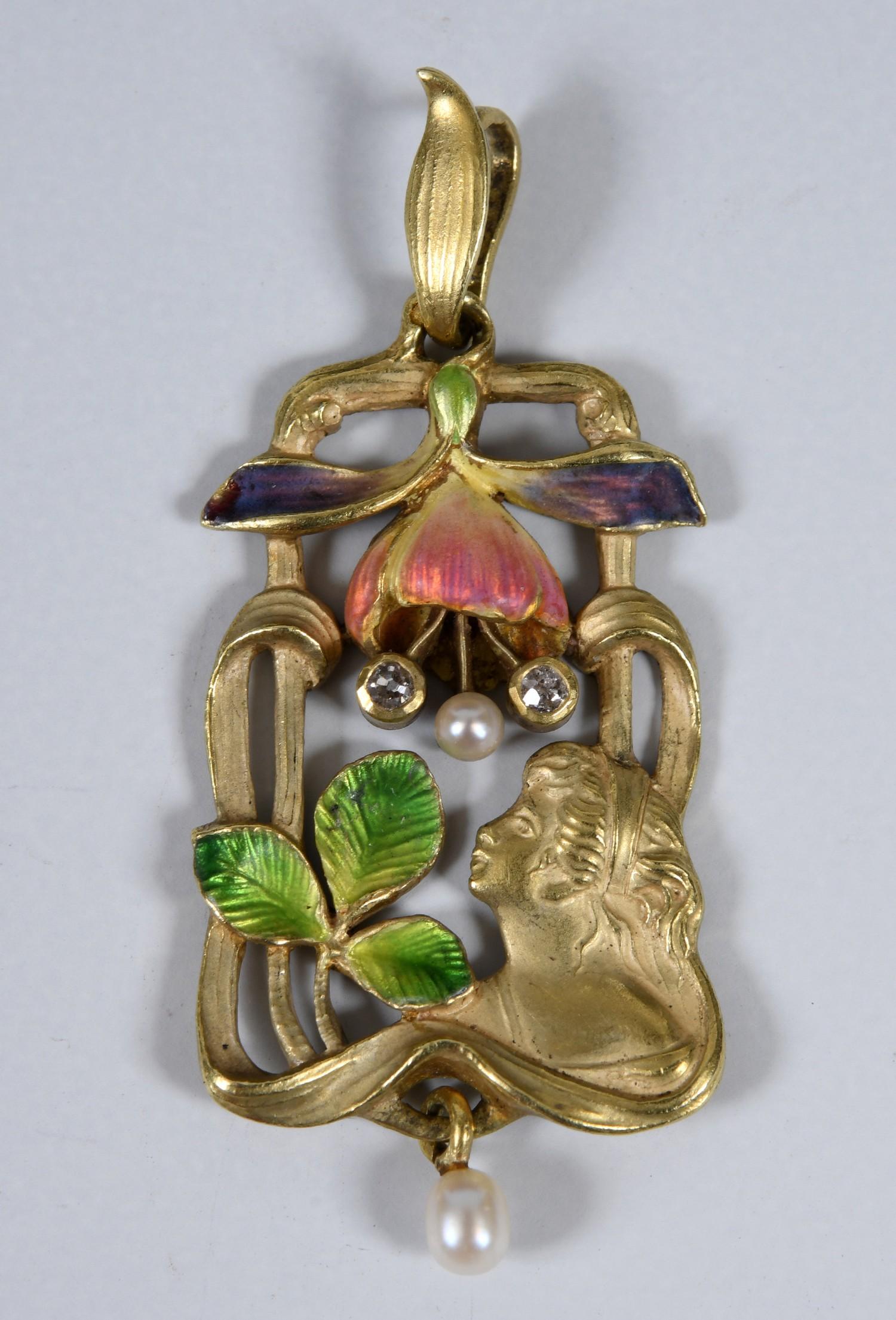 An Art Nouveau 18ct gold, enamel, diamond and seed pearl pendant, decorated a lady, a flower and