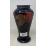 A Moorcroft pottery pomegranate pattern vase, of baluster form, 18 cm high