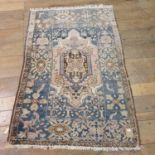 A Persian blue ground rug, 150 x 110 cm, an Afghan rug, 196 x 104 cm, and another 283 x 132 cm