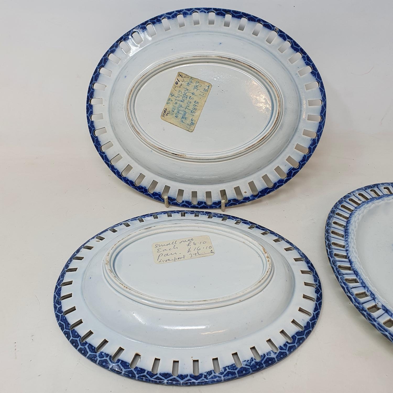 A set of three early 19th century blue and white oval dishes, with pierced rims, decorated - Image 2 of 2