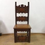 An oak hall chair, the back carved, Copied From an Old Chair in Titians House in Cadore