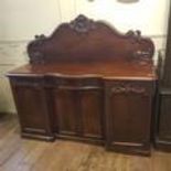 A 19th century mahogany chest, having two short and three long graduated drawers, on turned feet,
