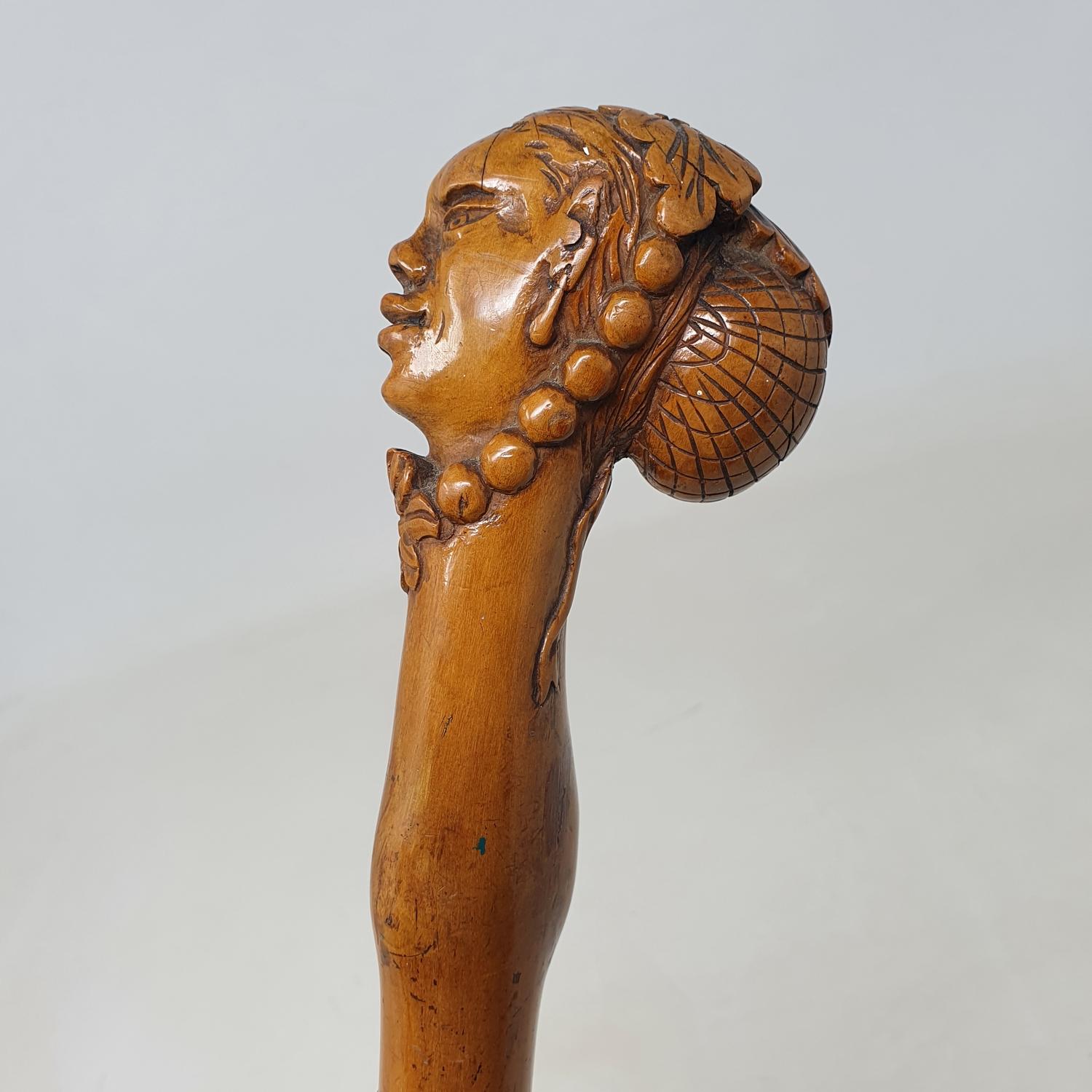 A 19th century folk art walking stick, the carved handle in the form of a lady in a bonnet and - Image 2 of 8