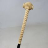 A walking stick, with barley twist carved ivory handle, on ebonised shaft, 85 cm