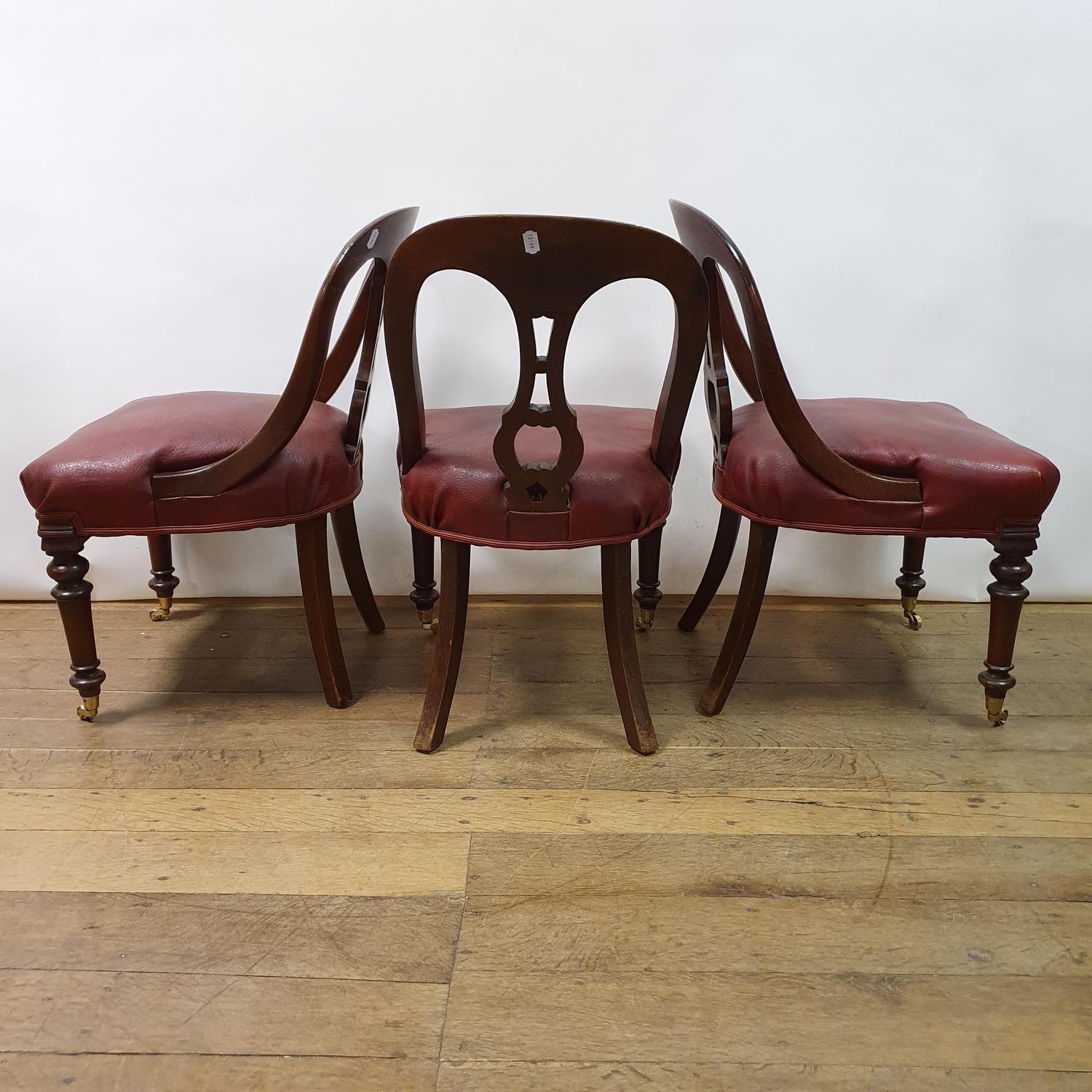 A set of six 19th century mahogany hoop back dining chairs, with padded seats on turned tapering - Image 2 of 2