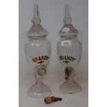 A pair of modern glass brandy dispensers, 35 cm high