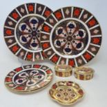 A pair of Royal Crown Derby Imari plates, 27 cm diameter, another pair, 18 cm diameter, a pair of