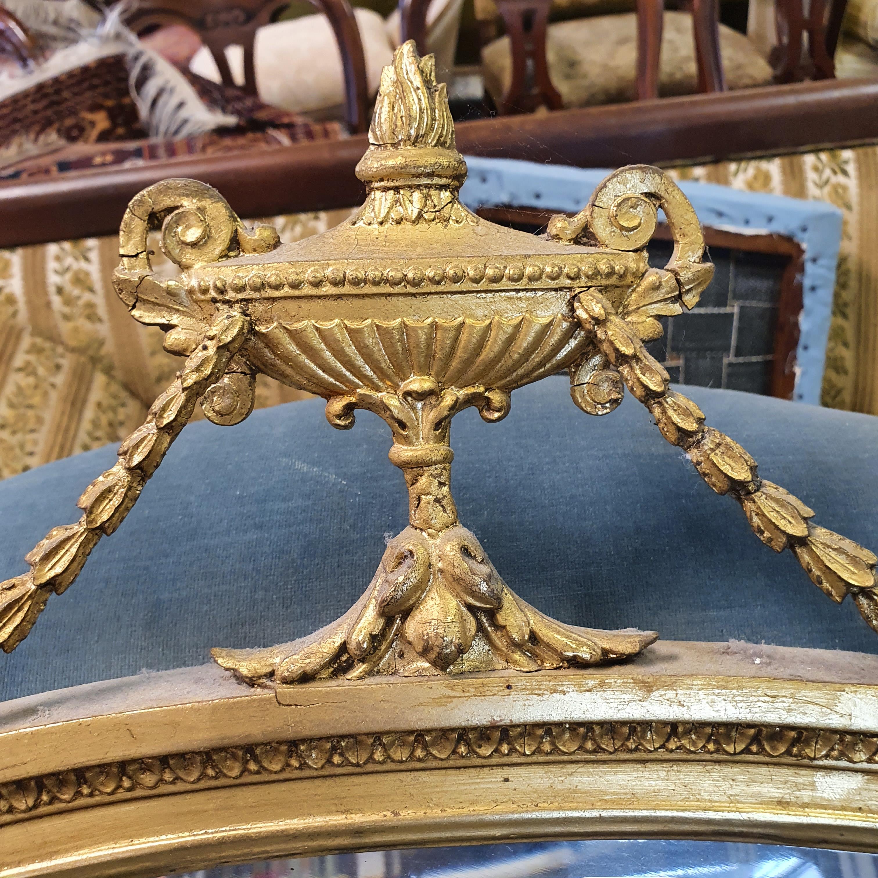 An oval gilt wall mirror, with a vase finial, 90 cm wide, and another mirror (2) - Image 3 of 3