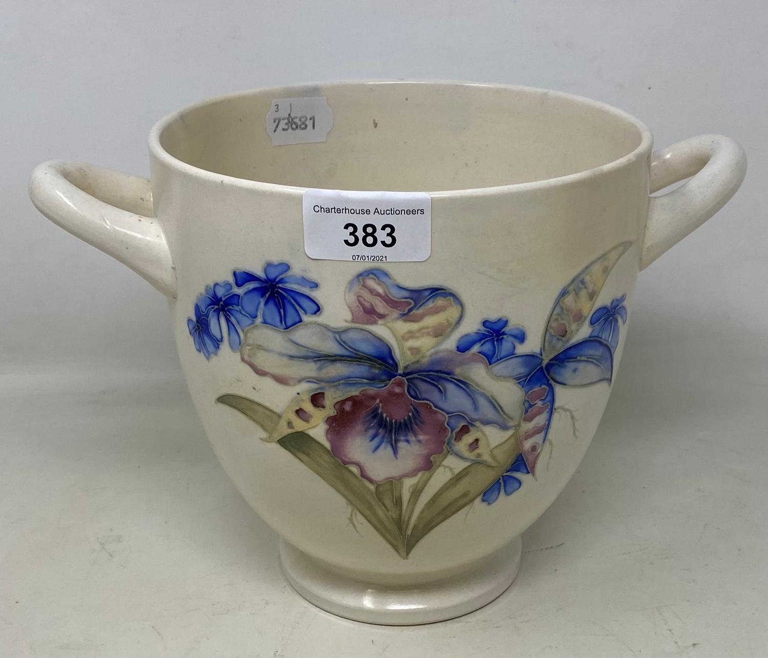 A Moorcroft pottery cache pot, decorated iris, with two handles, restored, 18 cm high