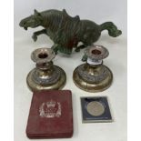 A pair of silver plated candlesticks, a spelter horse, and other items (box)
