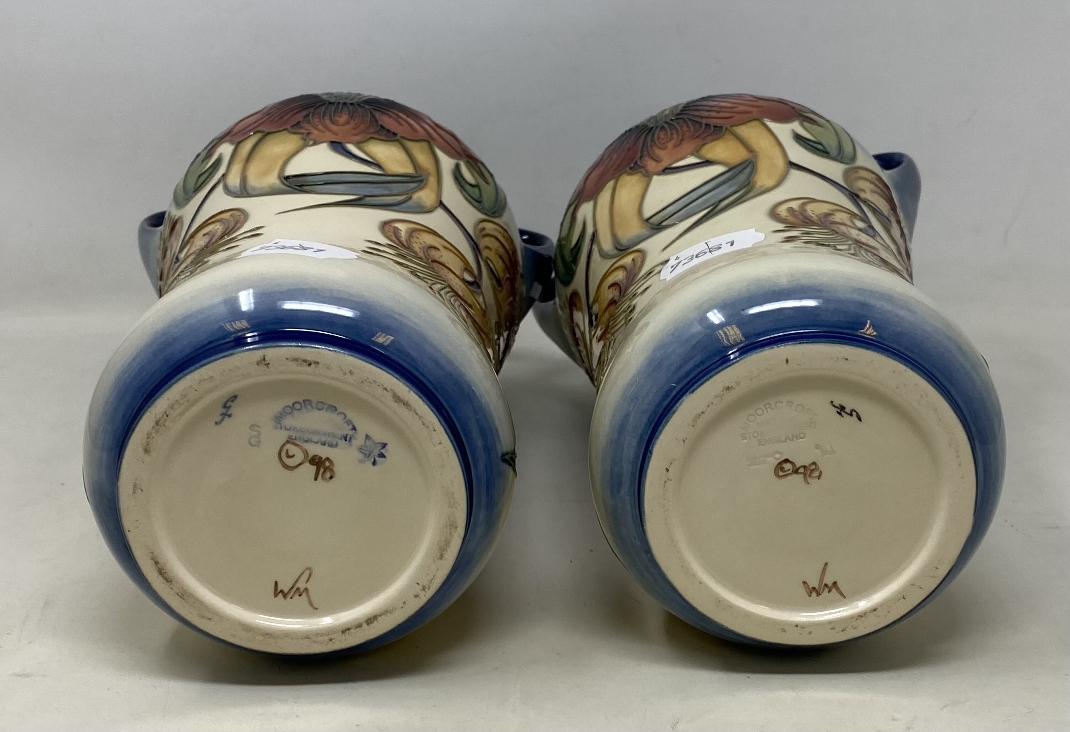 A pair of Moorcroft pottery vases, decorated flowers, with two handles and of waisted form, 25.5 - Image 4 of 4