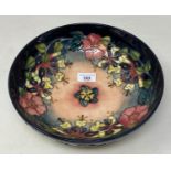 A Moorcroft pottery bowl, decorated flowers, 26 cm diameter