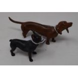 A modern painted metal figure of a French bulldog, 5 cm high, and another of a sausage dog (2)