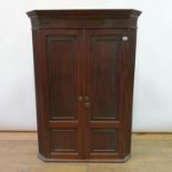 A 19th century mahogany hanging corner cabinet, 84 cm wide 83 cm wide, 44 cm deep, 116 cm tall